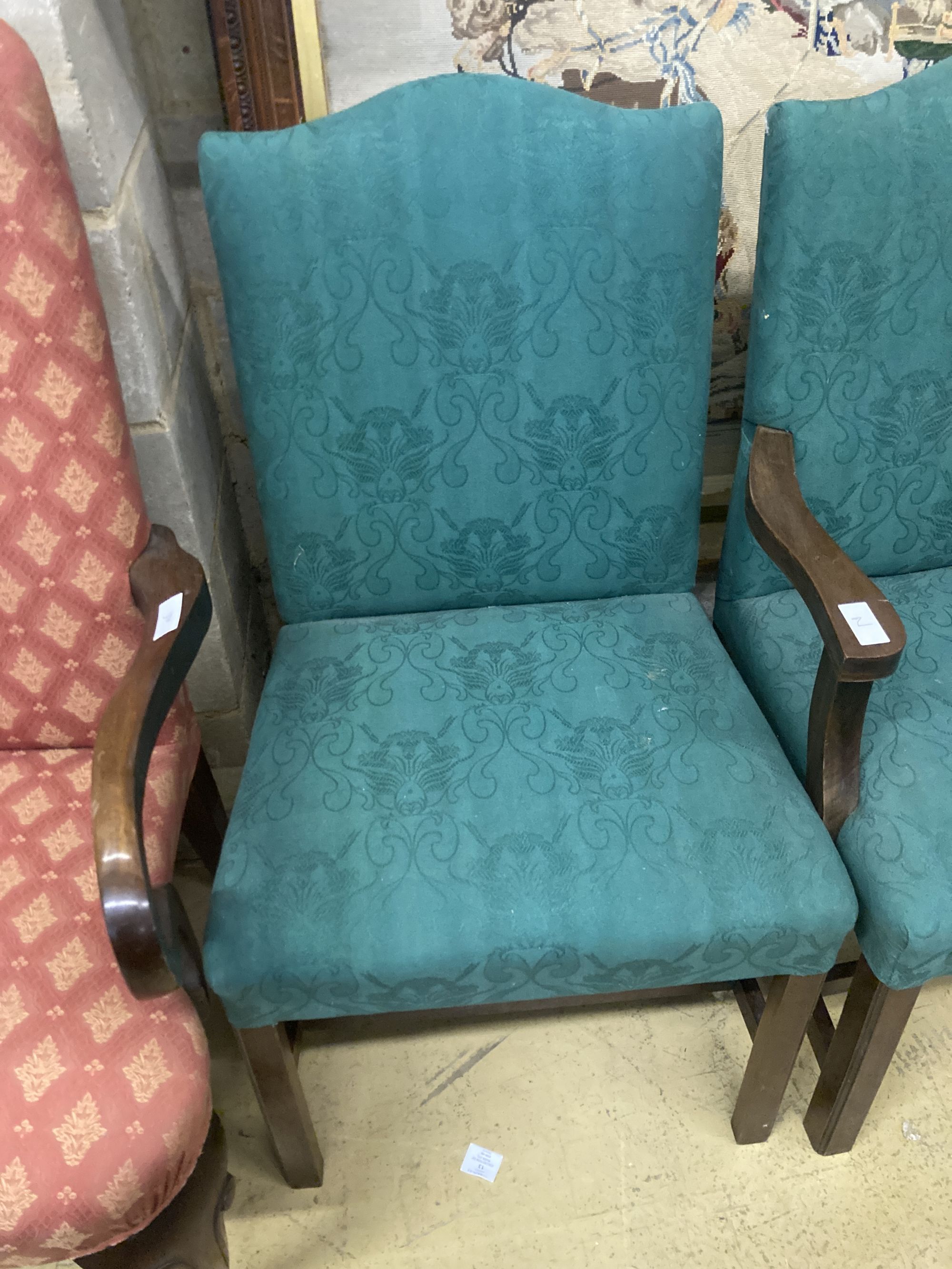 A pair of George III mahogany upholstered dining chairs (one with arms), width 62cm depth 52cm height 99cm